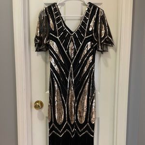 Size medium METME 20’s themed dress. Black and gold with black fringe.